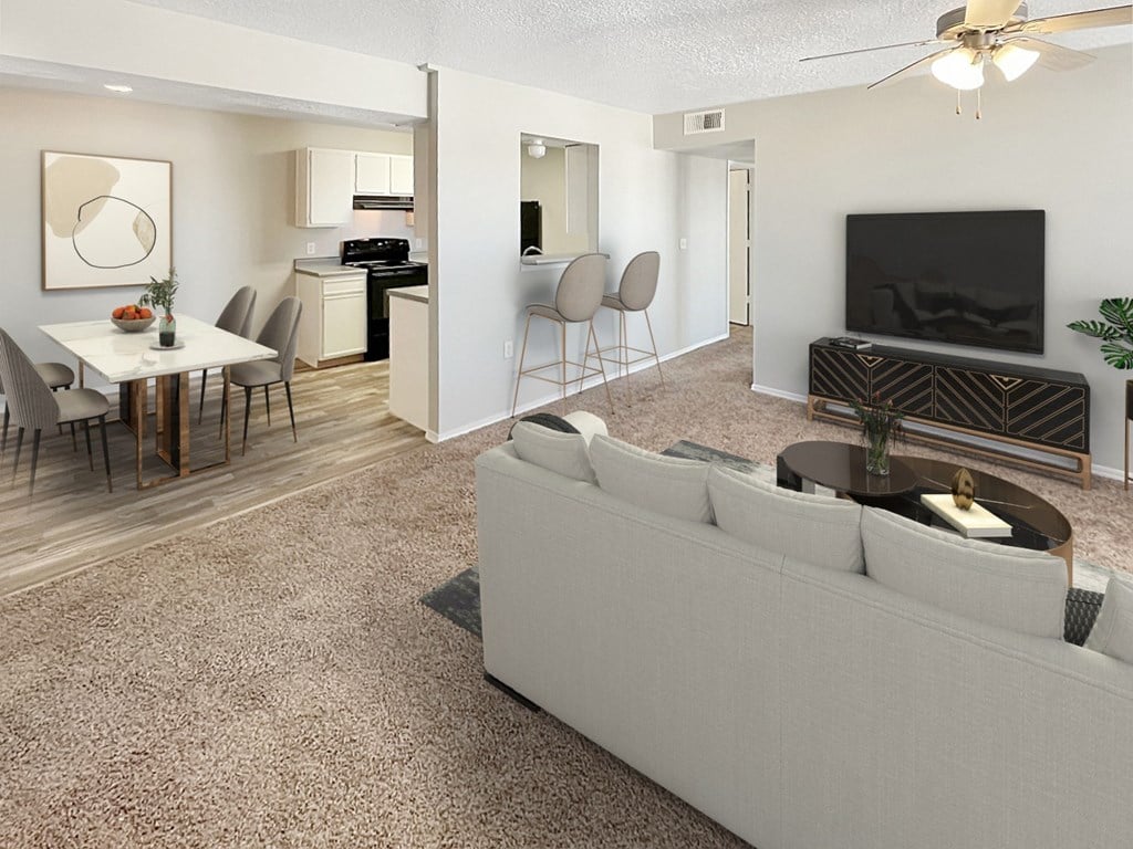 a living room and dining room with a couch and a table